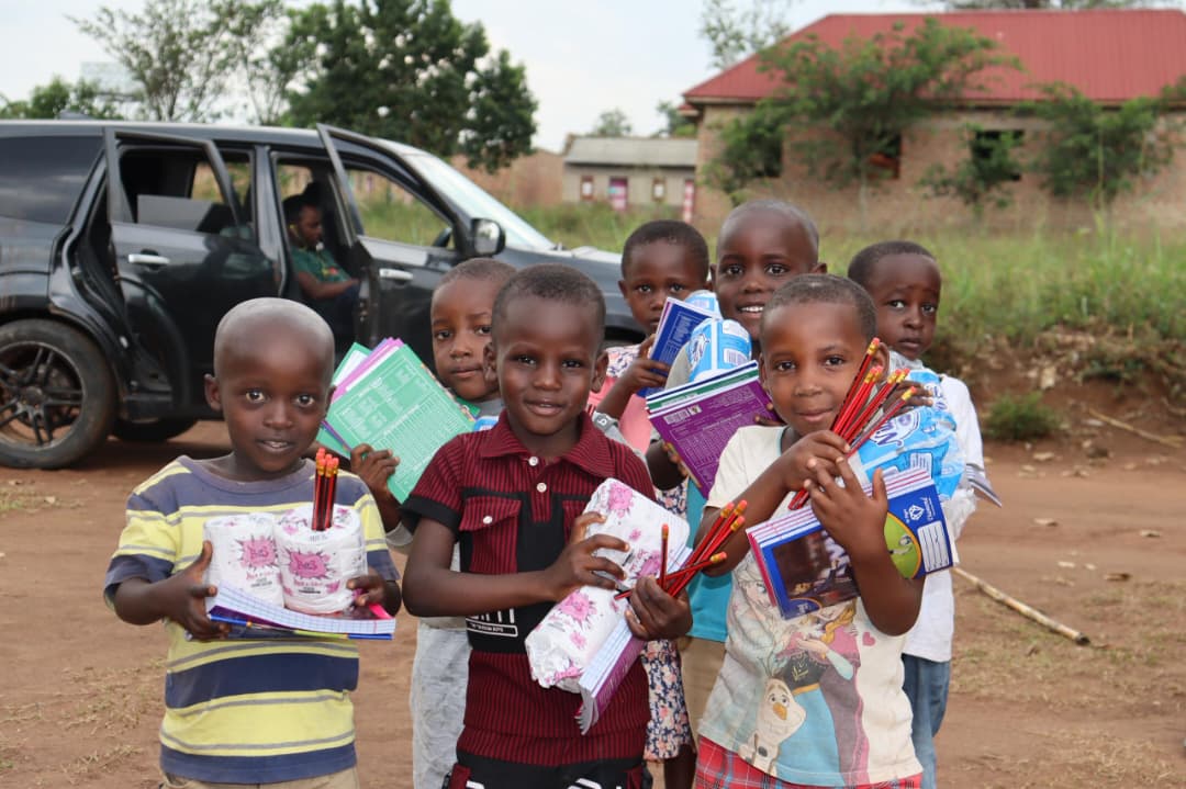 Children receiving support items through Somesa Child Project